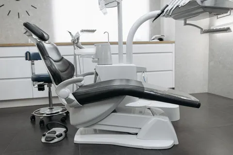 Empty dental chair and equipment in a bright modern clinic