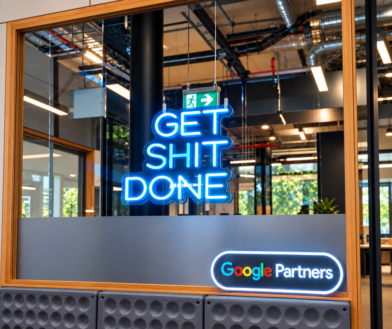 Blue neon sign reading get shit done above a Google Partners sign